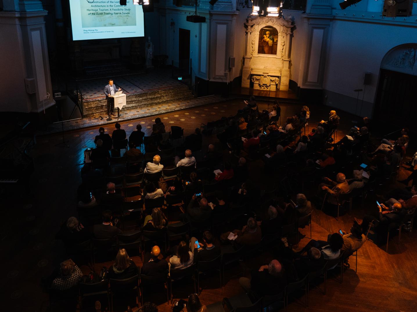 Venue full of seated audience
