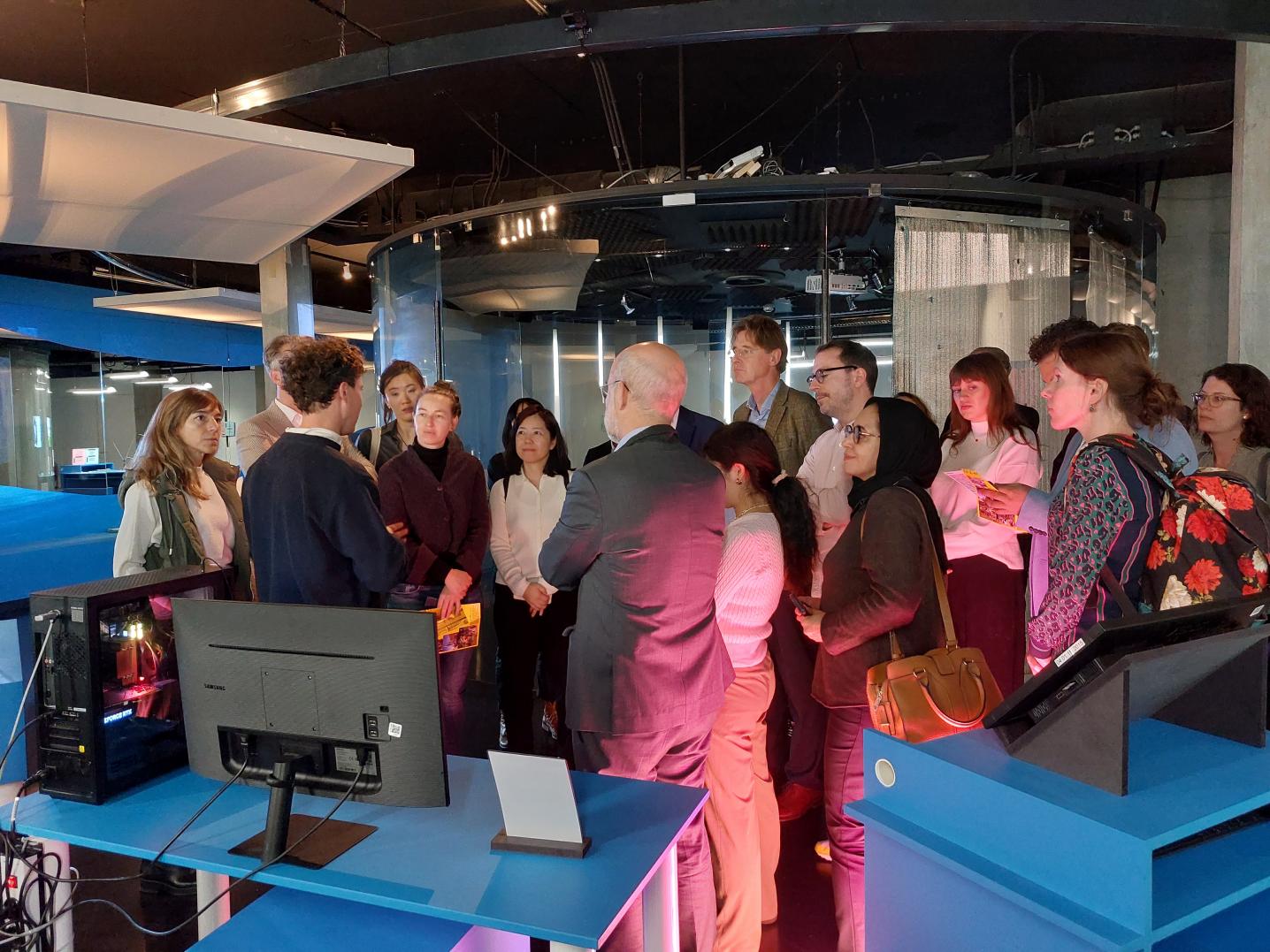 Group of people listening to a museum tour guide