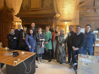 a group of people standing in an old room