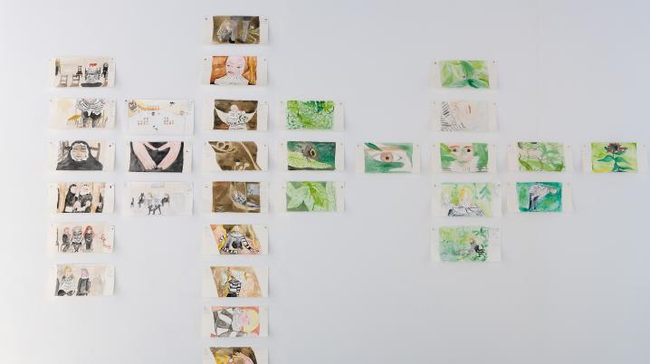 images of floral scenes displayed on a white exhibition wall